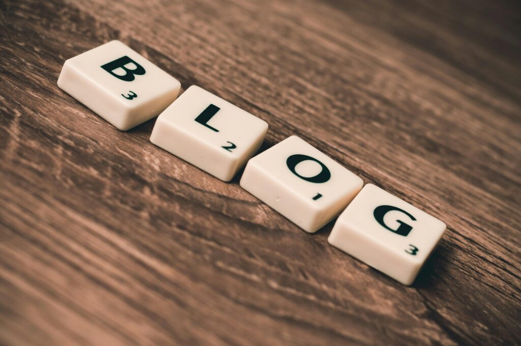 pexels photo 262508 262508 Scrabble tiles spelling 'BLOG' on a wooden background, symbolizing creativity and writing.
